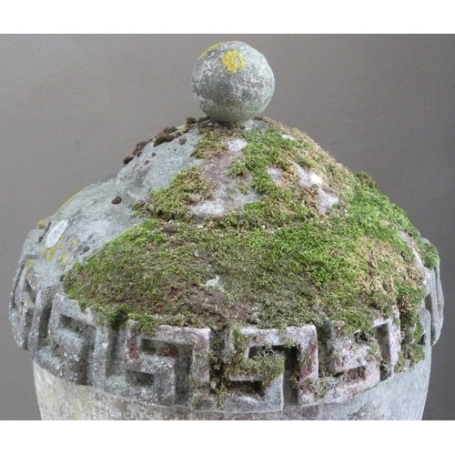 503 - A RECONSTITUTED STONE GARDEN VASE IN GEORGE III STYLE, the urnular shaped body with Greek key border... 