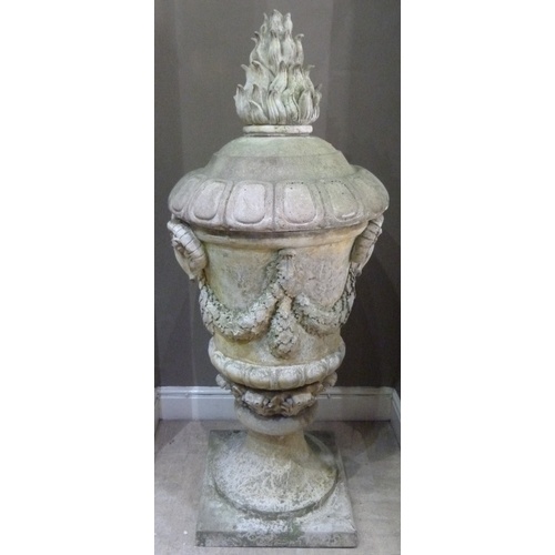 504 - A VICTORIAN STYLE CONCRETE GARDEN URN AND COVER, the body cast with pair of ram masks and oak leaf g... 