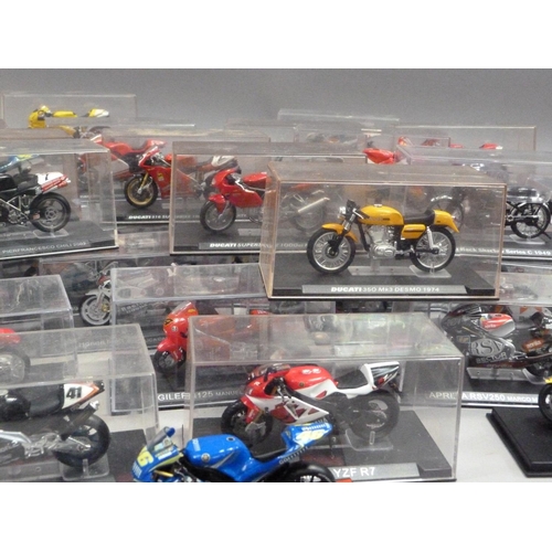 101 - Model Racing Bikes 1:24, forty-five models including Ducati, Yamaha and Honda, each in a perspex dis... 