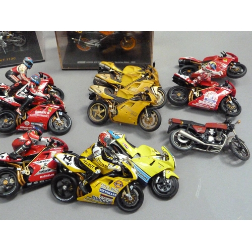 104 - A quantity of model racing bikes, 1:18 and 1:24 scale (13), together with various boxes and display ... 