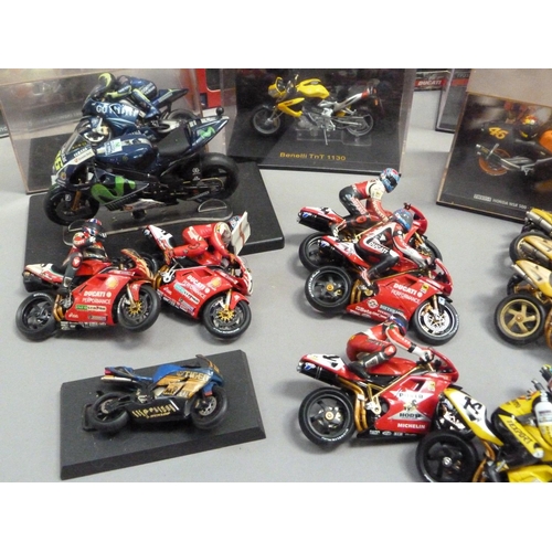 104 - A quantity of model racing bikes, 1:18 and 1:24 scale (13), together with various boxes and display ... 