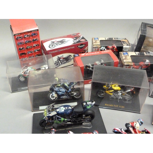 104 - A quantity of model racing bikes, 1:18 and 1:24 scale (13), together with various boxes and display ... 