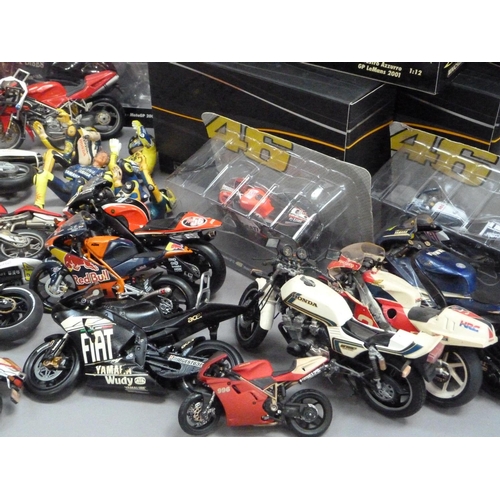 105 - A box of model racing bikes, mainly Minichamps, damaged or parts missing, some with original boxes