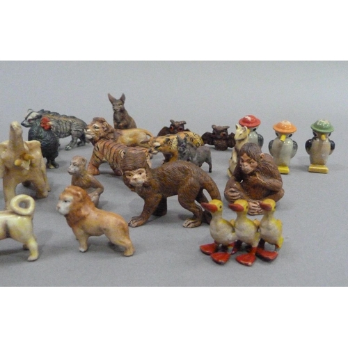 11 - A small collection of wild animal models, c.1940, including tiger, lion, hippopotamus, monkey, ape, ... 