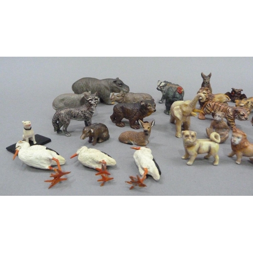 11 - A small collection of wild animal models, c.1940, including tiger, lion, hippopotamus, monkey, ape, ... 