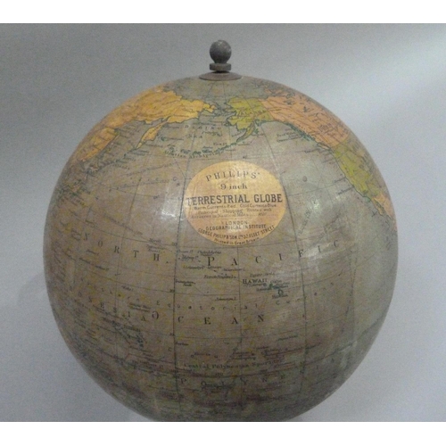 12 - A Phillips 9 inch terrestrial globe, c.1944, on black square stepped base