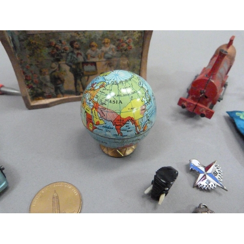 14 - A globe novelty pencil sharpener, 5cm high, together with a die cast sedan model pencil sharpener an... 