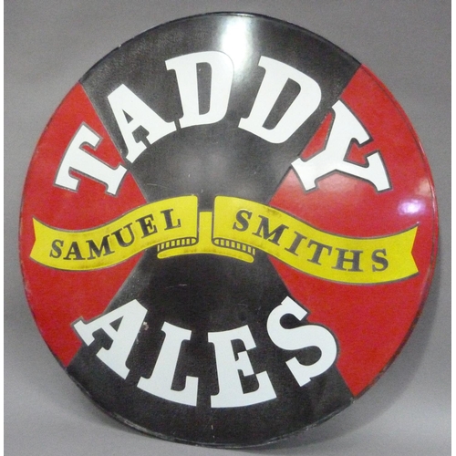 15 - A 'Taddy Ales' Samuel Smith Brewery enamel sign, circular, white lettering on black and red ground, ... 