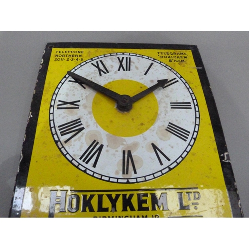 18 - An enamel advertising sign with clock for Hoklykem Ltd, 31cm x 24cm