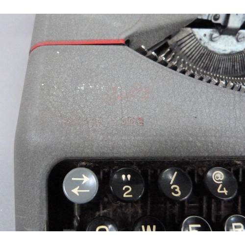 27 - A Hermes portable typewriter by Paillard in grey metal case