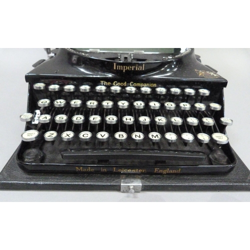 28 - An Imperial portable typewriter, black with gilt lettering, serial no. CO 540, in rexine covered cas... 