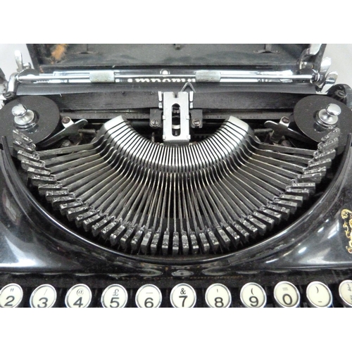 28 - An Imperial portable typewriter, black with gilt lettering, serial no. CO 540, in rexine covered cas... 