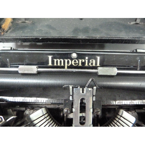 28 - An Imperial portable typewriter, black with gilt lettering, serial no. CO 540, in rexine covered cas... 