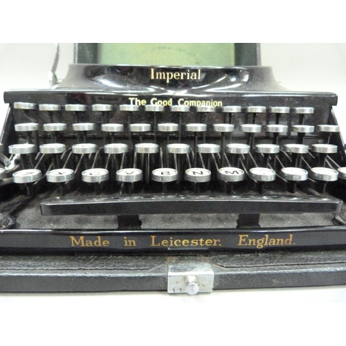 28 - An Imperial portable typewriter, black with gilt lettering, serial no. CO 540, in rexine covered cas... 