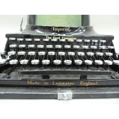 28 - An Imperial portable typewriter, black with gilt lettering, serial no. CO 540, in rexine covered cas... 