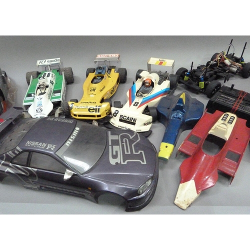 31 - Two radio controlled car, Nissan JGTR and Subaru Imprezza with radio gear and two spare body shells,... 