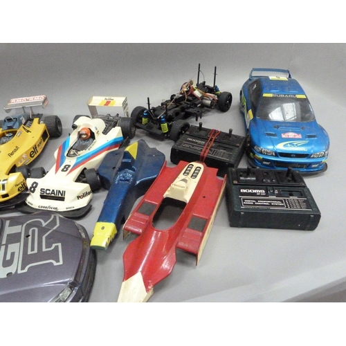 31 - Two radio controlled car, Nissan JGTR and Subaru Imprezza with radio gear and two spare body shells,... 