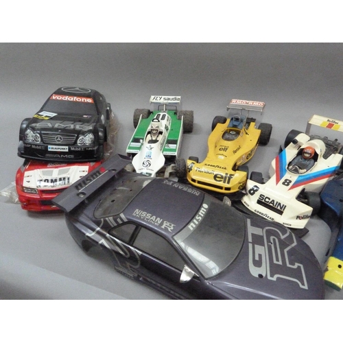 31 - Two radio controlled car, Nissan JGTR and Subaru Imprezza with radio gear and two spare body shells,... 