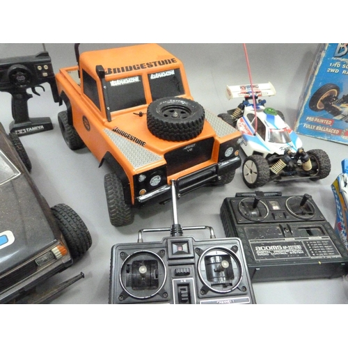 33 - Two radio controlled off-road buggies together with off-road Subaru and four-wheel drive Landrover, ... 