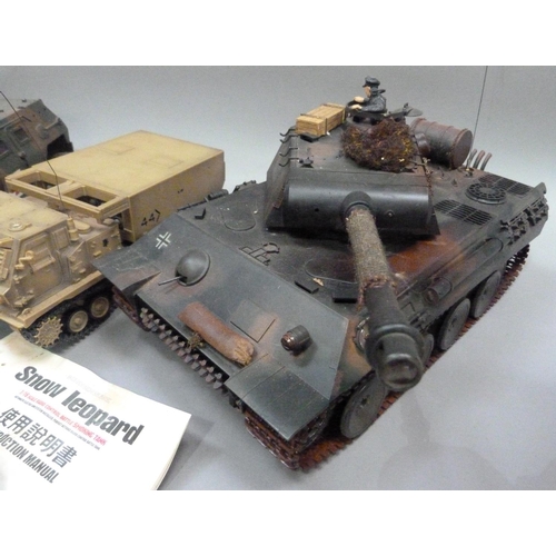 34 - Radio controlled Leopard tank, Panzer tank, medical armoured car and track rocket launcher, all with... 