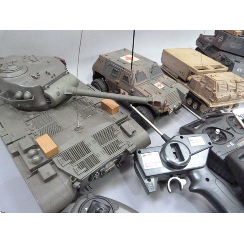 34 - Radio controlled Leopard tank, Panzer tank, medical armoured car and track rocket launcher, all with... 