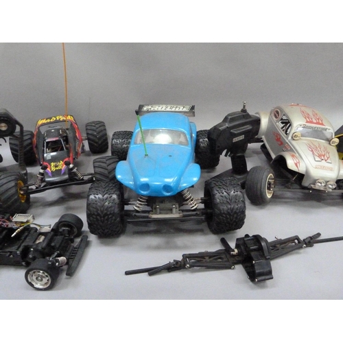 35 - Radio controlled off-road buggy together with two off-road Baja beetles and unbranded track racer, t... 