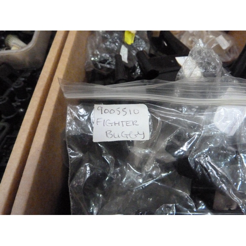 39 - A quantity of spare model parts to include plastic mouldings, chassis, etc. in four boxes (4)