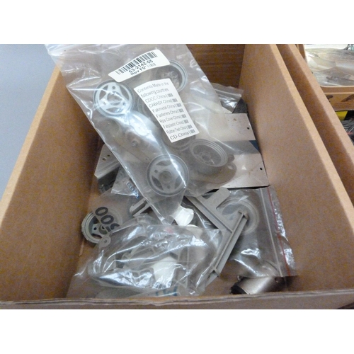 40 - A quantity of spare model parts to include plastic mouldings, field chargers and electrical ancillar... 