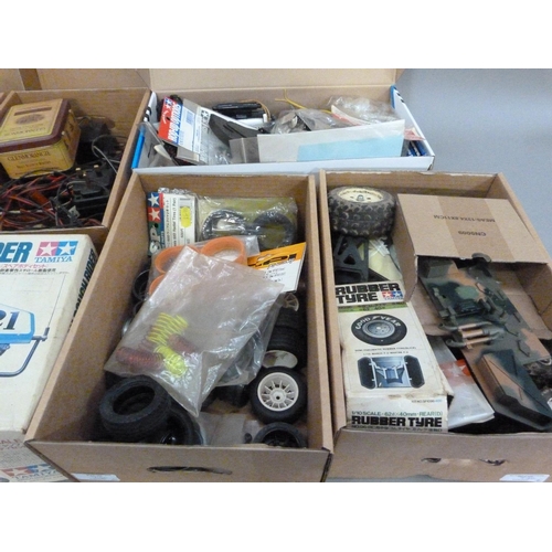 40 - A quantity of spare model parts to include plastic mouldings, field chargers and electrical ancillar... 