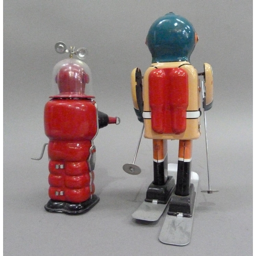 47 - South Pole Explorer B-17 skier tin plate clockwork robot, 21.5cm high, together with Moon Explorer t... 