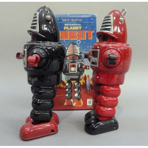 49 - Ko Toys Planet Robot tin plate clockwork robot, black, 23cm, boxed, together with another in red (no... 