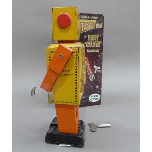 51 - Robot Lilliput tin plate clockwork robot, yellow, 22cm, boxed