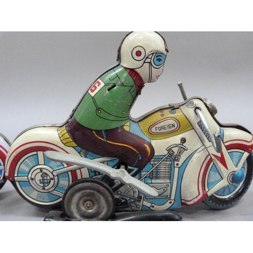 52 - A tinplate clockwork motorcyclist, c.1960s (arms missing) together with a reproduction of the same m... 