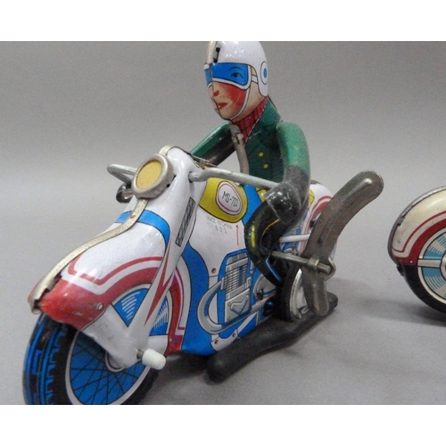 52 - A tinplate clockwork motorcyclist, c.1960s (arms missing) together with a reproduction of the same m... 