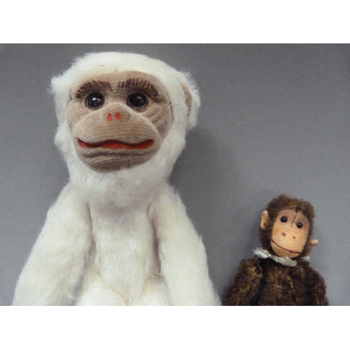 8 - A Norah Wellings monkey, white plush and fawn velvet face, feet and hands, approximately 24cm, label... 