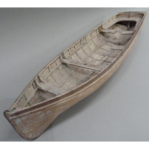 9 - An early 20th century wood and copper bound model of a rowing boat (one half seat off but present), ... 