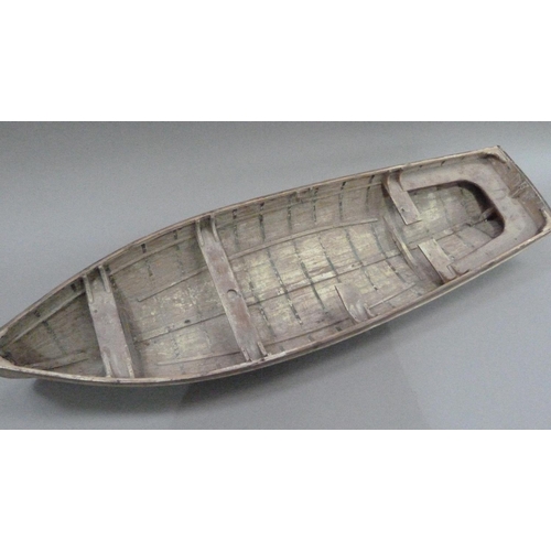 9 - An early 20th century wood and copper bound model of a rowing boat (one half seat off but present), ... 