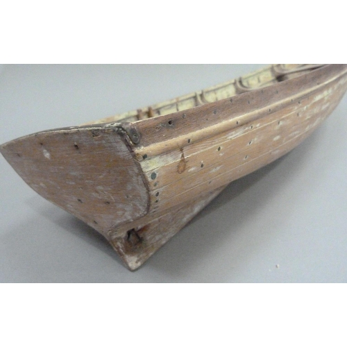 9 - An early 20th century wood and copper bound model of a rowing boat (one half seat off but present), ... 