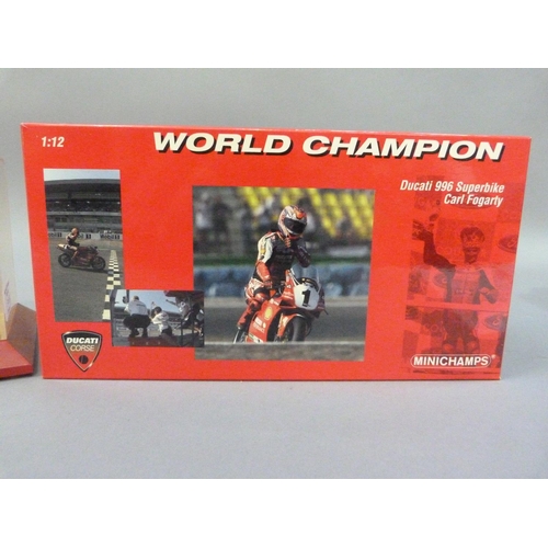 91 - Minichamps 1:12 Ducati 996 Superbike 1999 and 2000 Carl Fogarty, both boxed, together with a display... 