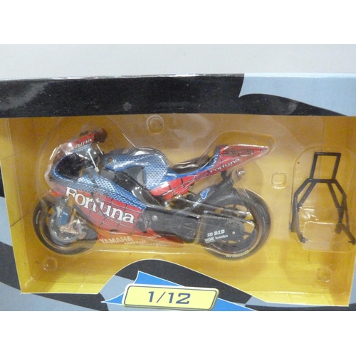 97 - Five model motor racing bikes including KTM 1:12 MotoGP Model Bike Smith; Automaxx Premium 1:12; Duc... 