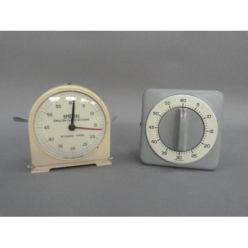 110 - A Smiths Fishing Clock Systems cream metal clock with seconds timer, together with a Junghans metal ... 