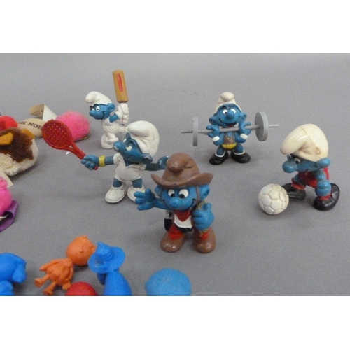 112 - Five sporting Smurfs and a cowboy Smurf together with a quantity of promotional bugs and twelve Magi... 