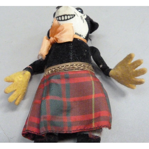 201 - A Deans Rag Book model of Minnie Mouse in a Scottish tartan skirt, reg. no. to neck, 17cm long