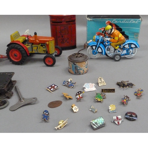 203 - A Zetor tinplate tractor and trailer, a PenduPet tinplate motorcyclist in original box, a Chad Valle... 