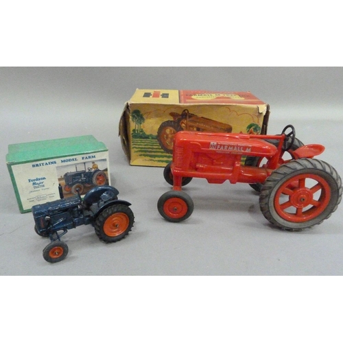 224 - An International Harvester Farmall M Tractor, plastic model, in original box, together with a Britai... 