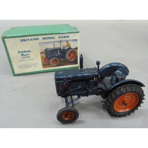 224 - An International Harvester Farmall M Tractor, plastic model, in original box, together with a Britai... 