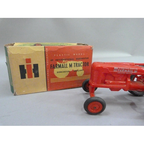 224 - An International Harvester Farmall M Tractor, plastic model, in original box, together with a Britai... 