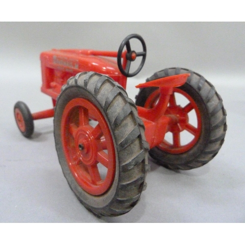 224 - An International Harvester Farmall M Tractor, plastic model, in original box, together with a Britai... 