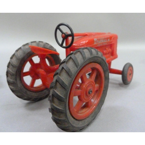 224 - An International Harvester Farmall M Tractor, plastic model, in original box, together with a Britai... 