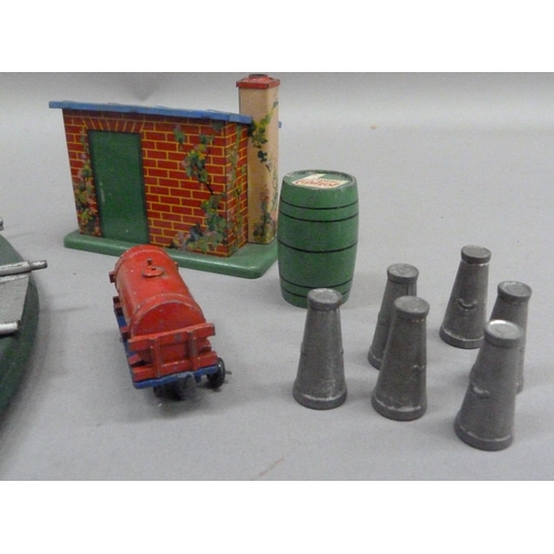 232 - A Hornby O gauge turntable, a plate layer's hut, six milk churns and a Hornby shell tanker